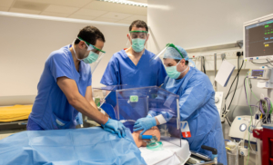 Dr. Samer Arnous, Tony Moloney and Nick Barrett at University Hospital Limerick, testing UL produced visors and shield box