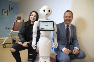 Diabetes patient and project participant Abigail with Dave the Robot and Prof Derek O'Keeffe