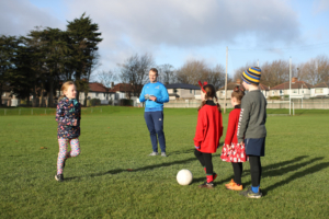 Dr Stephen Behan DCU with children from Na Fianna GAA Club, who are participating in the Moving Well Being Well Project