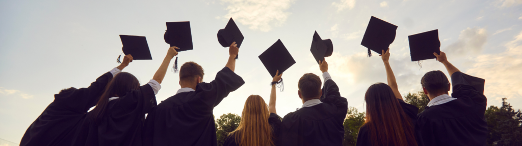 People in graduation cap and gowns