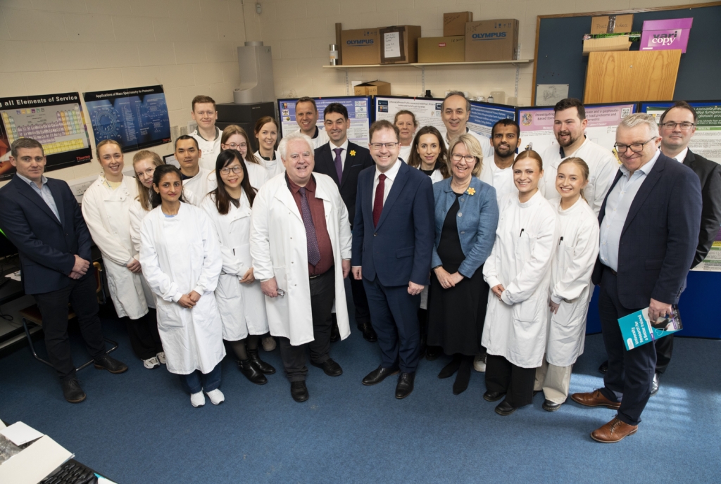 Researchers and PhD students of the MU Biology Dept with Minister James Lawless, Prof Eeva Leinonen, Deputy Joe Neville, Prof Paul Moynagh Head of MU Human Health Institute